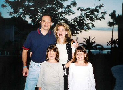 Here's me on vacation with my wife Jackie and our six-year-old twins, Haley (l) and Lindsay (r), having just watched another beautiful Florida sunset.